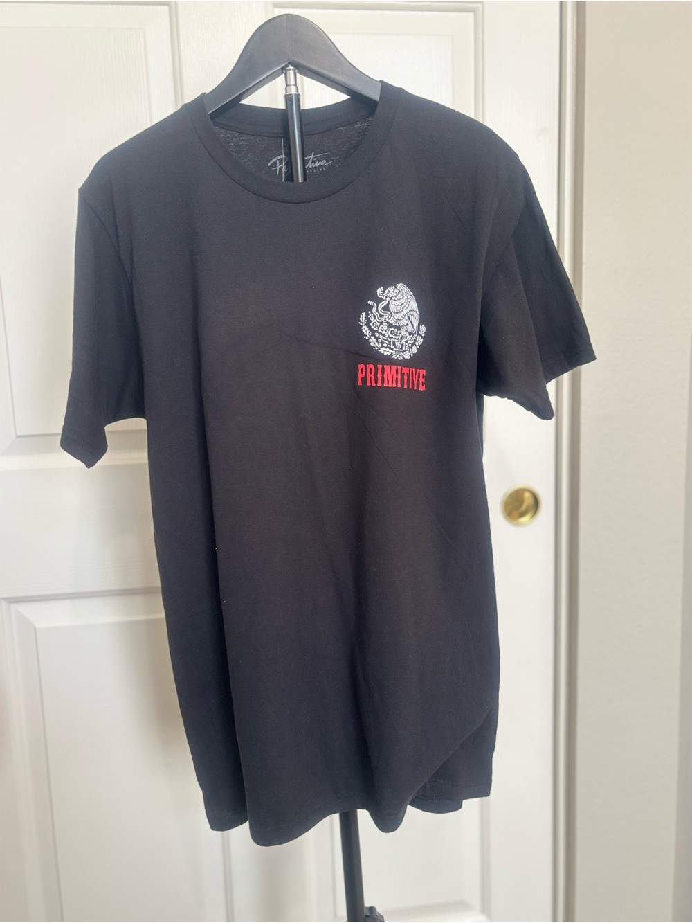 Primitive Skateboarding Black Short-Sleeve Tee with White Crest and Red Logo
